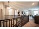 View of the open loft area featuring a built in bookshelf and a fireplace at 3698 Regatta Landing Dr, Las Vegas, NV 89141