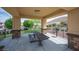 Community picnic area with a large table, barbecue grill, and picturesque views of the surrounding neighborhood at 3698 Regatta Landing Dr, Las Vegas, NV 89141