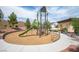 Community playground with a slide, climbing features, and a safety surface for enjoyment at 3698 Regatta Landing Dr, Las Vegas, NV 89141