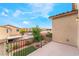 Balcony with neighborhood views of green spaces, swimming pool and nearby homes on a sunny day at 3746 Asia Rd, North Las Vegas, NV 89032