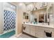 Bathroom featuring double sinks and separate shower/tub at 3746 Asia Rd, North Las Vegas, NV 89032