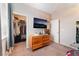 Bedroom featuring closet, dresser, and tv; a relaxing space at 3746 Asia Rd, North Las Vegas, NV 89032