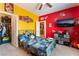 Colorful bedroom with bright walls, fun decor, and a closet at 3746 Asia Rd, North Las Vegas, NV 89032