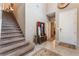 Inviting foyer with high ceilings, a staircase, and neutral tile flooring leads to other parts of the home at 3746 Asia Rd, North Las Vegas, NV 89032