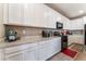 Bright kitchen showcases white cabinetry, granite countertops, and stainless steel appliances at 3746 Asia Rd, North Las Vegas, NV 89032