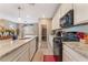 Well-equipped kitchen featuring granite countertops, stainless steel appliances, and white cabinets at 3746 Asia Rd, North Las Vegas, NV 89032