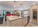 Open-concept kitchen with granite countertops, a view of the pantry, and stainless steel appliances at 3746 Asia Rd, North Las Vegas, NV 89032