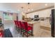Spacious kitchen island with granite countertops, bright lighting, and modern appliances and white cabinetry at 3746 Asia Rd, North Las Vegas, NV 89032