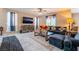 Comfortable living room with stylish furnishings, a large window, and a ceiling fan at 3746 Asia Rd, North Las Vegas, NV 89032