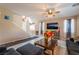 Comfortable living room area with tile flooring, a ceiling fan, and easy access to the stairway at 3746 Asia Rd, North Las Vegas, NV 89032