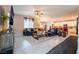 Inviting living room featuring tile floors, a ceiling fan, and comfortable seating and an open floor plan at 3746 Asia Rd, North Las Vegas, NV 89032