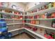 Spacious pantry with lots of shelving for ample storage of food items and other home goods at 3746 Asia Rd, North Las Vegas, NV 89032