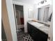Spacious bathroom includes a modern vanity with granite counter, shower, and updated flooring at 3771 Desert Marina Dr # 95, Laughlin, NV 89029