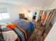 Bedroom with natural light features wood floors, closet, dresser, and ensuite bathroom at 3771 Desert Marina Dr # 95, Laughlin, NV 89029