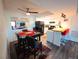 Dining area adjacent to the kitchen with a ceiling fan and laminate floors at 3771 Desert Marina Dr # 95, Laughlin, NV 89029