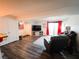 Spacious living room featuring laminate floors, comfortable seating, and sliding glass doors to a patio at 3771 Desert Marina Dr # 95, Laughlin, NV 89029
