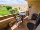Cozy patio space with table, chairs, and grill, perfect for outdoor dining and relaxing at 3771 Desert Marina Dr # 95, Laughlin, NV 89029