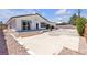 The house with a large back yard and three concrete stairs leading to the backyard at 405 Oil Lantern Ln, Las Vegas, NV 89145