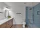 Modern bathroom features a glass shower enclosure and a wood vanity at 405 Oil Lantern Ln, Las Vegas, NV 89145