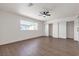 Spacious bedroom features wood floors, ceiling fan, a sliding closet and bright window at 405 Oil Lantern Ln, Las Vegas, NV 89145