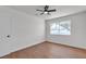 Bright bedroom features modern ceiling fan, wood-look floors and a window providing ample natural light at 405 Oil Lantern Ln, Las Vegas, NV 89145