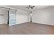 Spacious bedroom features wood floors, ceiling fan, a sliding closet and bright window at 405 Oil Lantern Ln, Las Vegas, NV 89145