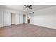 Spacious bedroom features wood floors, ceiling fan, a sliding closet and bright window at 405 Oil Lantern Ln, Las Vegas, NV 89145