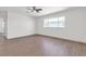 Bright bedroom has modern ceiling fan, new flooring and bright window at 405 Oil Lantern Ln, Las Vegas, NV 89145