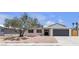 Charming single-story home with mature tree, solar panels, and a spacious two-car garage at 405 Oil Lantern Ln, Las Vegas, NV 89145