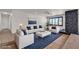 Bright living room with fireplace, modern furniture, and large window, great for entertaining at 405 Oil Lantern Ln, Las Vegas, NV 89145