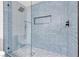 Modern walk in shower with a niche and honeycomb tile at 405 Oil Lantern Ln, Las Vegas, NV 89145