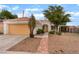 Well-maintained single-story home featuring an attached two-car garage and covered patio at 4110 Bonita Desert Ct, North Las Vegas, NV 89032