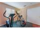 Home gym with a treadmill, exercise machine, neutral paint, window and closet at 4110 Bonita Desert Ct, North Las Vegas, NV 89032