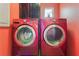 Bright red laundry room featuring LG washer and dryer at 4110 Bonita Desert Ct, North Las Vegas, NV 89032