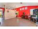 An open living space with tile flooring, a partial wall, and modern lighting at 4110 Bonita Desert Ct, North Las Vegas, NV 89032