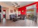 Relaxing living room features cozy couches and a sliding glass door to backyard at 4110 Bonita Desert Ct, North Las Vegas, NV 89032