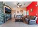 Comfortable living room with tile floors, a stone fireplace, and relaxing seating at 4110 Bonita Desert Ct, North Las Vegas, NV 89032