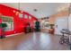 Cozy living room with tile floors and vibrant red accent wall at 4110 Bonita Desert Ct, North Las Vegas, NV 89032