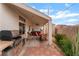 Spacious covered patio with built-in barbecue, jacuzzi, and dining area at 4110 Bonita Desert Ct, North Las Vegas, NV 89032