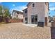 Gravel backyard with a sliding glass door at 4149 Dignified Ct, North Las Vegas, NV 89032