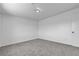 The bedroom features a neutral carpet, a light fixture, and access to the hallway through a white door at 4149 Dignified Ct, North Las Vegas, NV 89032