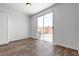 Cozy bedroom with wood floors and a sliding glass door leading to the outside at 4149 Dignified Ct, North Las Vegas, NV 89032