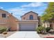 Charming two-story home featuring a two-car garage and well-maintained landscaping at 4149 Dignified Ct, North Las Vegas, NV 89032