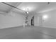 Spacious garage featuring bright lighting and an automatic door opener at 4149 Dignified Ct, North Las Vegas, NV 89032