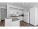 Efficient kitchen with white cabinets, granite countertops and modern appliances at 4149 Dignified Ct, North Las Vegas, NV 89032