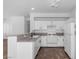 Bright kitchen featuring white cabinets, granite countertops and appliances at 4149 Dignified Ct, North Las Vegas, NV 89032