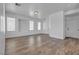 Inviting living area featuring wood floors, neutral walls, and abundant natural light at 4149 Dignified Ct, North Las Vegas, NV 89032