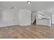 Bright and airy living space with hardwood flooring and staircase access at 4149 Dignified Ct, North Las Vegas, NV 89032
