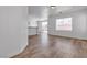 Open-concept living area featuring wood floors, natural light and sliding glass door at 4149 Dignified Ct, North Las Vegas, NV 89032