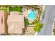 Stunning aerial view of a home featuring a private pool, spa, outdoor fire pit, and desert landscaping at 419 Vigo Port St, Las Vegas, NV 89138